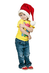 Image showing little girl in santa hat on a white background