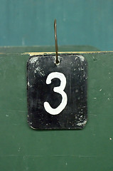 Image showing number tag, three