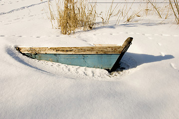 Image showing Blue boat covered by snow