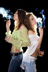 Image showing Portrait of the two pretty girlfriends with a cigars