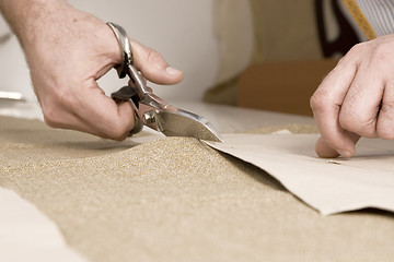 Image showing detail of tailor's hand with scissors