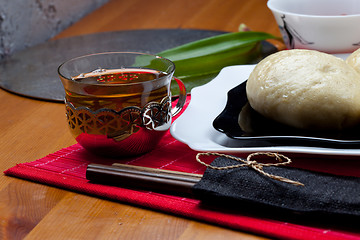 Image showing red tea and korean cakes pyan-se