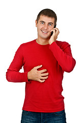 Image showing man in a red dress speaks on a mobile phone.