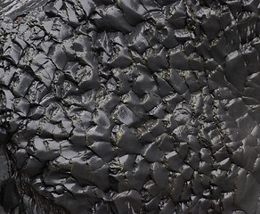 Image showing Texture of wet black rock