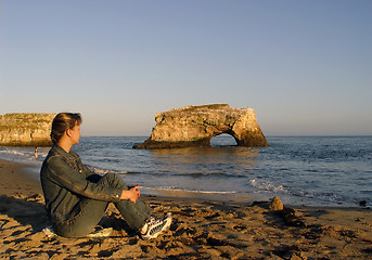 Image showing Woman relaxing on the beach