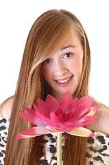 Image showing Portrait of girl with flower.