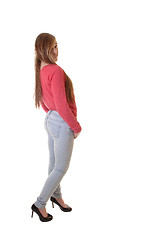 Image showing Girl in jeans and sweater.