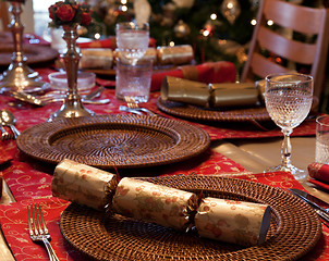 Image showing English Christmas table with crackers