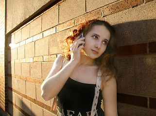 Image showing Girl in a city at sunset