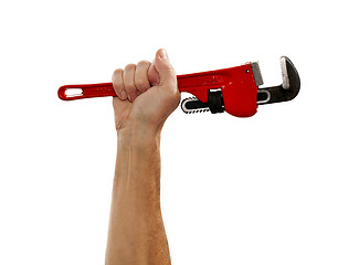 Image showing Senior man holding a large wrench