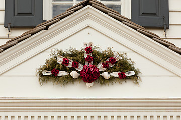 Image showing Traditional xmas wreath above front door