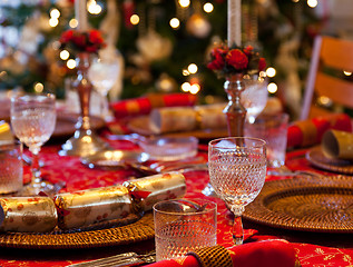 Image showing English Christmas table with crackers