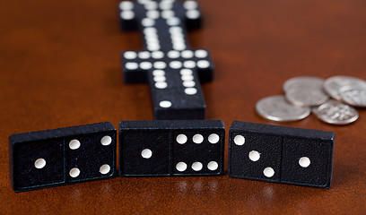 Image showing Game of dominoes on leather table