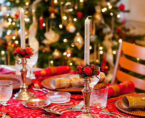 Image showing English Christmas table with crackers