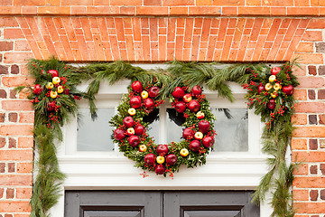 Image showing Traditional xmas wreath above front door