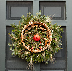 Image showing Traditional xmas wreath on front door