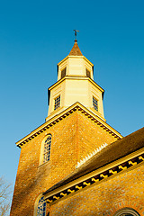 Image showing Warm sunlight on Bruton parish church tower