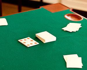 Image showing Antique playing cards on green table