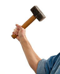 Image showing Senior man holding a large hammer