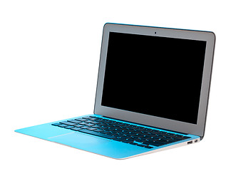 Image showing Silver laptop lit with blue tint