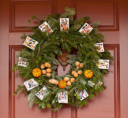 Image showing Traditional xmas wreath on front door