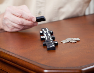 Image showing Game of dominoes on leather table