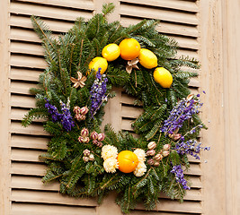 Image showing Traditional xmas wreath on front door