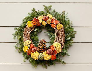 Image showing Traditional xmas wreath on front door