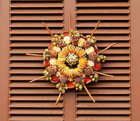 Image showing Traditional xmas wreath on front door