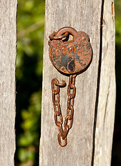 Image showing Antique lock and chain on wood