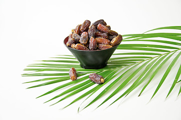 Image showing Plate full of Dates Fruit isolated on white Background