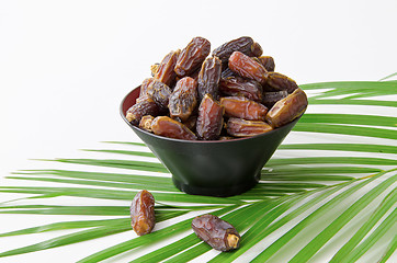 Image showing Plate full of Dates Fruit isolated on white Background