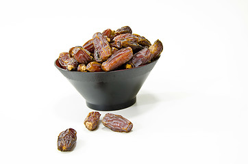 Image showing Plate full of Dates Fruit isolated on white Background