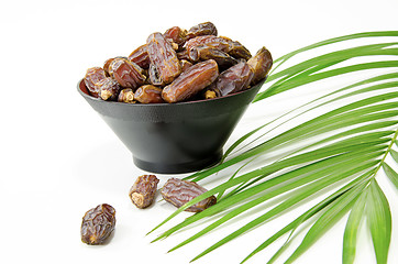 Image showing Plate full of Dates Fruit isolated on white Background