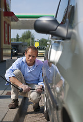 Image showing Inflating a tyre