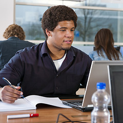 Image showing Student behind laptop