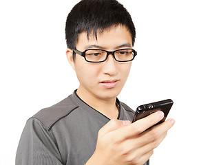 Image showing man writting SMS on mobile phone