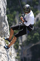Image showing Young female rock climber
