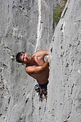 Image showing Male rock climber looking up.