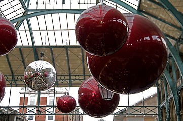 Image showing Huge red glass balls