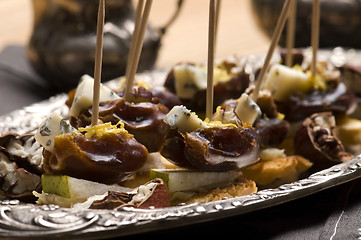 Image showing Appetizer Plate with Dactyl, Pecan nuts and Cheese