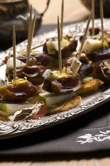 Image showing Appetizer Plate with Dactyl, Pecan nuts and Cheese