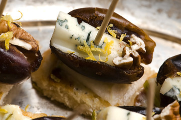 Image showing Appetizer Plate with Dactyl, Pecan nuts and Cheese