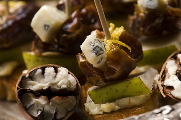 Image showing Appetizer Plate with Dactyl, Pecan nuts and Cheese