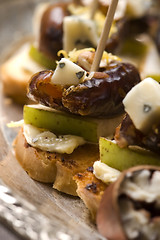 Image showing Appetizer Plate with Dactyl, Pecan nuts and Cheese