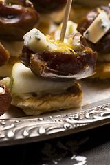 Image showing Appetizer Plate with Dactyl, Pecan nuts and Cheese