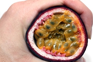 Image showing passion fruit hand