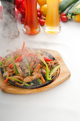 Image showing original fajita sizzling hot  on iron plate