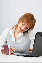 Image showing Attractive happy girl in office