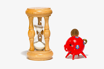 Image showing object isolated white shadow hourglass and pig-box